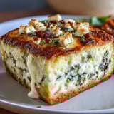 Topped with golden crust, this High Protein Spinach Artichoke Bake pairs well with a fresh green salad.