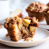 Fluffy Seasonal Spiced Pear and Walnut Muffins, golden brown and smelling heavenly, ready to serve.